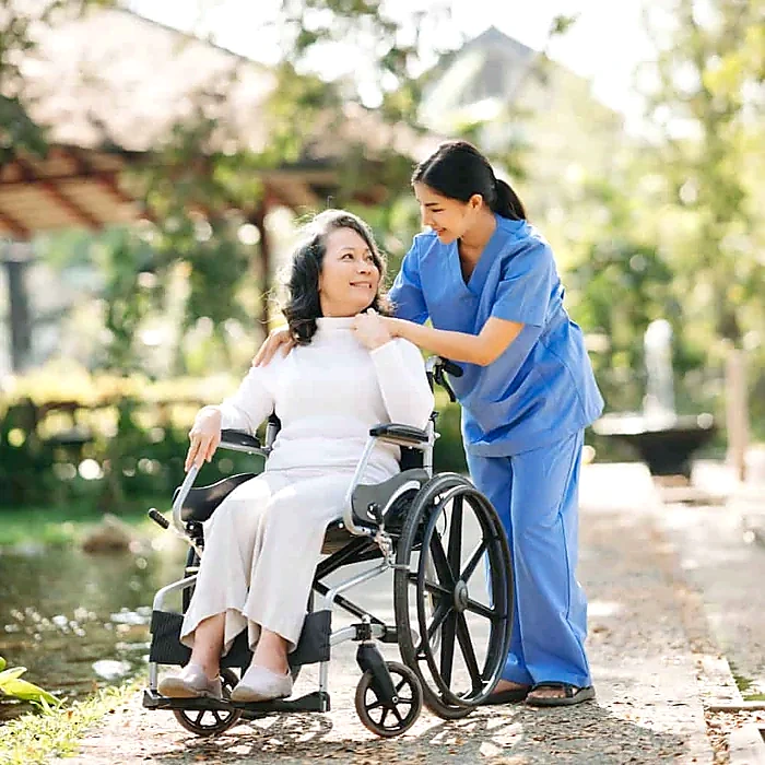 Caregiver assisting a senior in a wheelchair